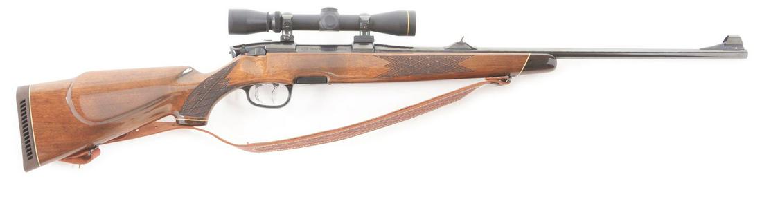 (M) LEFT HAND STEYR MODEL M BOLT ACTION RIFLE WITH: .30-06 Springfield, 23 - 1/2" round barrel, blue finish, walnut stock. This rifle features a hooded ramp blade front and express style notch rear sights. The receiver is drilled, tapped, and mounted w