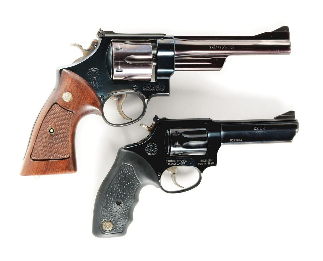 (M) LOT OF 2: SMITH & WESSON AND TAURUS REVOLVERS.: Lot consists of: (A) Smith & Wesson Model 28 six shot double action revolver with fluted cylinder, ramp front sight, target rear sight, blued finish, case colored hammer and trigger, and silver medall