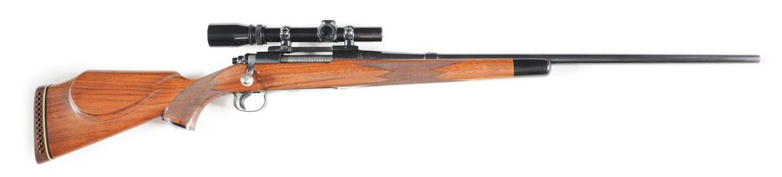 (C) REMINGTON MODEL 721 ADL MAGNUM BOLT ACTION RIFLE: With 1-3/4-5 Burris scope, deluxe checkered wood, and ebony forend tip. CONDITION: Near mint with most all original finish. Excellent bore. Barrel Length: 26" Caliber/Bore: .300 Weatherby Magnum FFL S