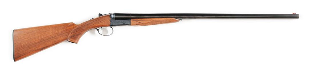 (M) ITHACA MODEL 100 12 BORE SIDE BY SIDE SHOTGUN: A quality side by side featuring 28" matted barrels that are choked "IMP" on right barrel and "MOD" on left. Chambers measure 2 - 3/4". Length of pull is 14 - 1/8" to hard plate. Single trigger, matte