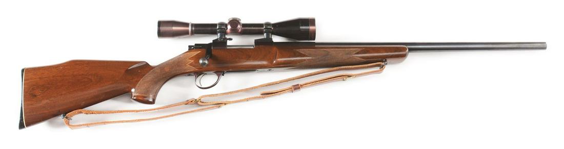 (C) SAKO VIXEN BOLT ACTION RIFLE WITH SCOPE.: Varmint weight barrel with wide varmint stock. 5 round internal box magazine with drop floor plate, Redfield/Sako rings and bases with Leupold 7.5X40 mm scope. Chambered for .222 Remington Mag. Factor