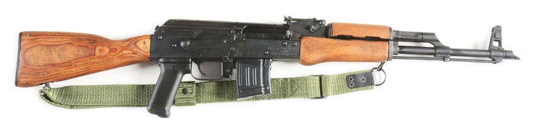 (M) ROMANIAN WASR-10 AK PATTERN SEMI-AUTOMATIC RIFLE.: Standard semi-automatic AK-47 design with wooden furniture. Stamped receiver. Polymer grip. Stamped right side for manufacture by Romarm SA/Cugir and imported by Century Arms. CONDITION: Fine, retaini
