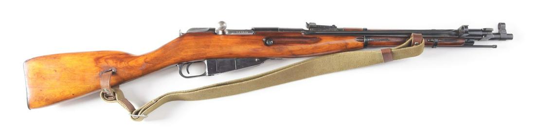 (C) IZHEVSK MOSIN NAGANT MODEL 44 BOLT ACTION CARBINE.: Russian made Mosin Nagant Model 44 bolt action carbine made in 1946 and imported by C.A.I. of Georgia , Vermont. Izhevsk arsenal proofs on receiver. Blued receiver with blued barrel. Military sights a