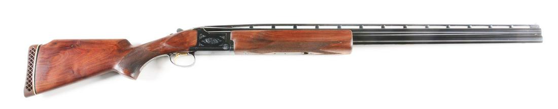 (M) BROWNING CITORI 12 BORE GRADE 1 OVER/UNDER SHOTGUN.: Made in a target configuration, this gun has a high matted ventilated top rib with white front bead. Large forend is checkered in point pattern with Deeley release. Action is engraved in typical grade