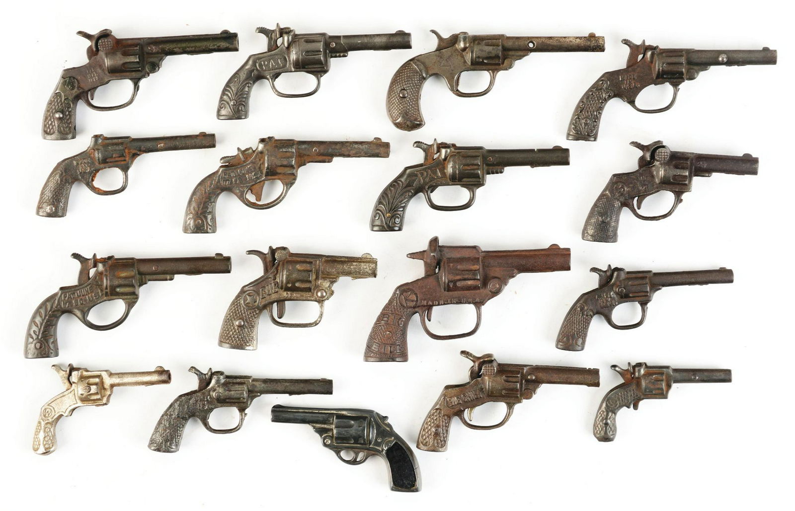 Lot of 17: Mostly 20th Century Cast-Iron Cap Guns.: Lot consists of many Kenton, some Stevens and other makers. Many guns are named, "Army", "Navy", two "Gip" guns, "Pony" and several others. Mostly 1920s and 1930s. Various conditions but overall very