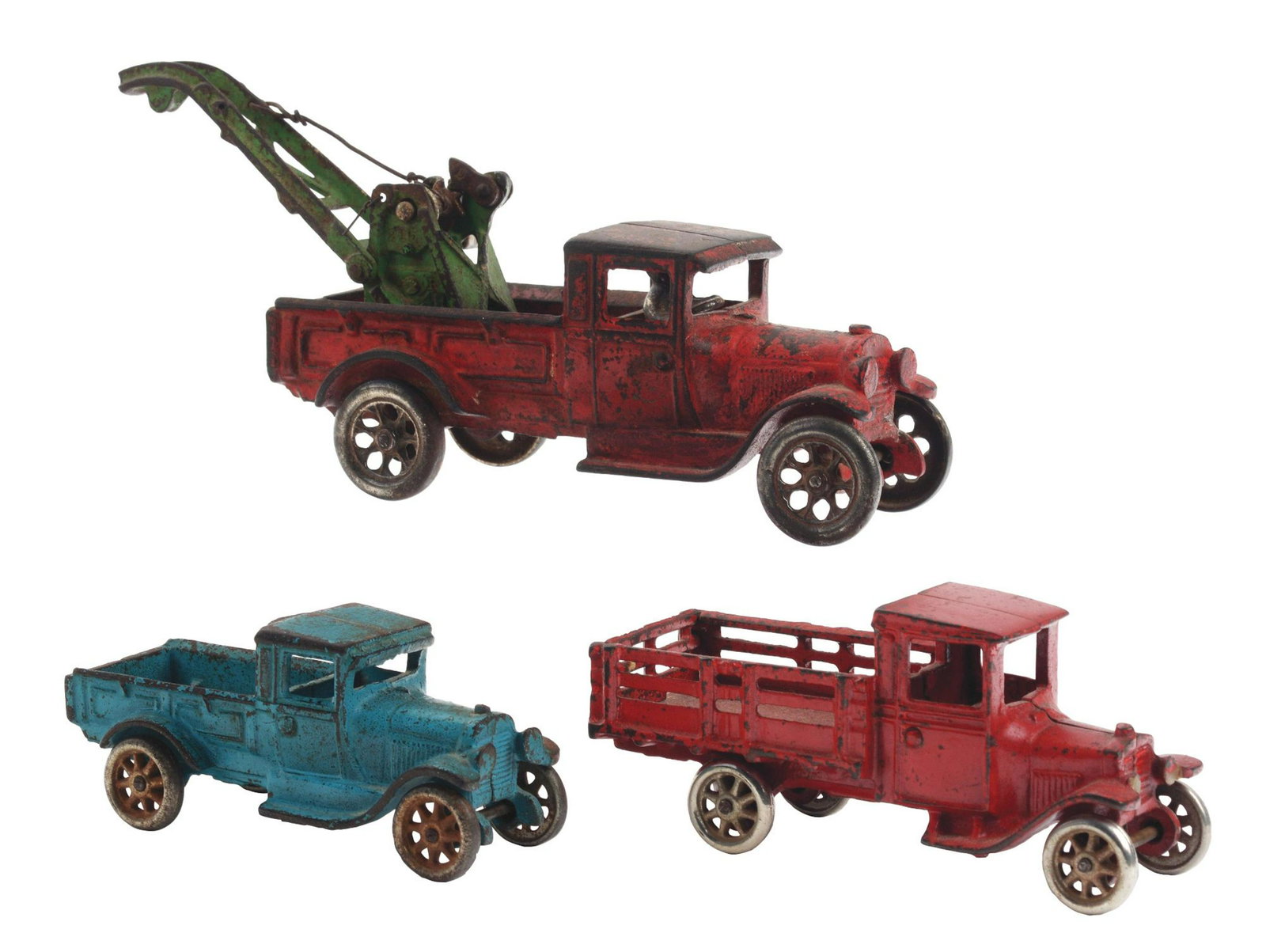 Lot of 3: Arcade Cast-Iron Toys.: Lot consists of: Wever wrecker in good condition, stake truck in excellent condition and an express truck in very good condition. (JY) Condition: (Very Good). Dimensions: Largest: 11 - 1/2” x 3” x