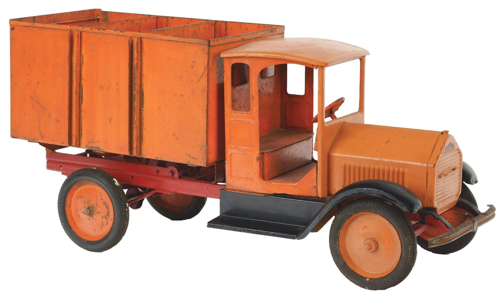 Pressed Steel Sturditoy Pull Truck.: Black rubber tires, nice Sturditoy decals inside on flooring and on rear of truck. Has back funnel but no ramps. Two original metal inserts are present. Might have some repainting to front hood. Condi