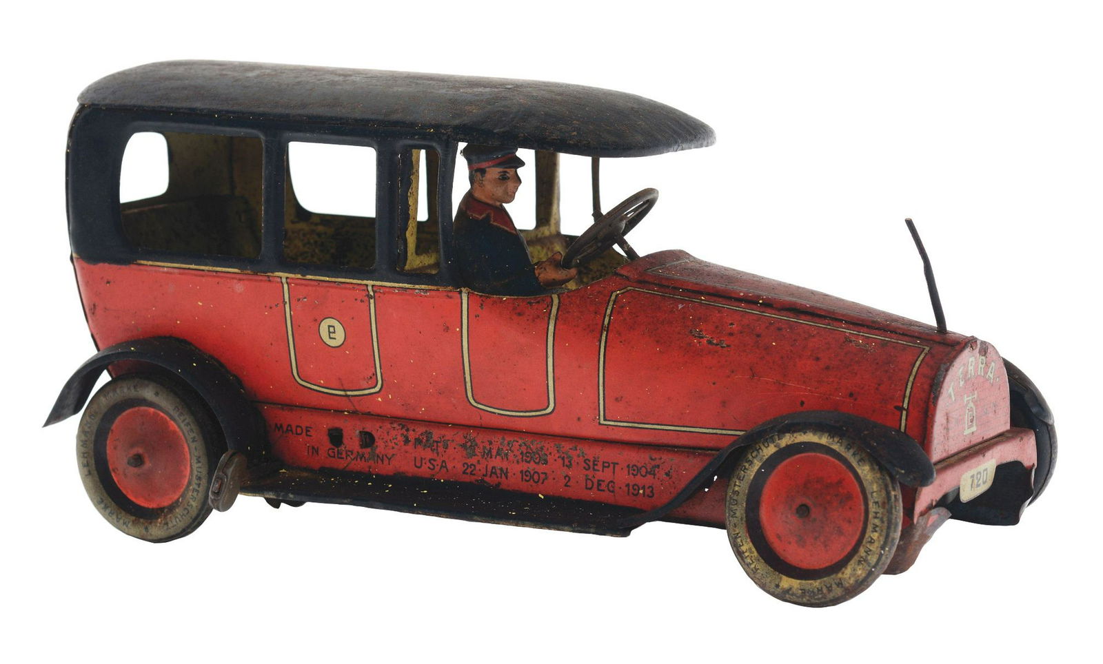 German Lehmann Tin-Litho Wind-Up Terra Automobile.: Marked "DRGM" and "TERRA" on front grille, original tin-litho driver and steering wheel but missing cloth flag on front. Post is still present, marked "720" on rear license plate. Some oxidation and l
