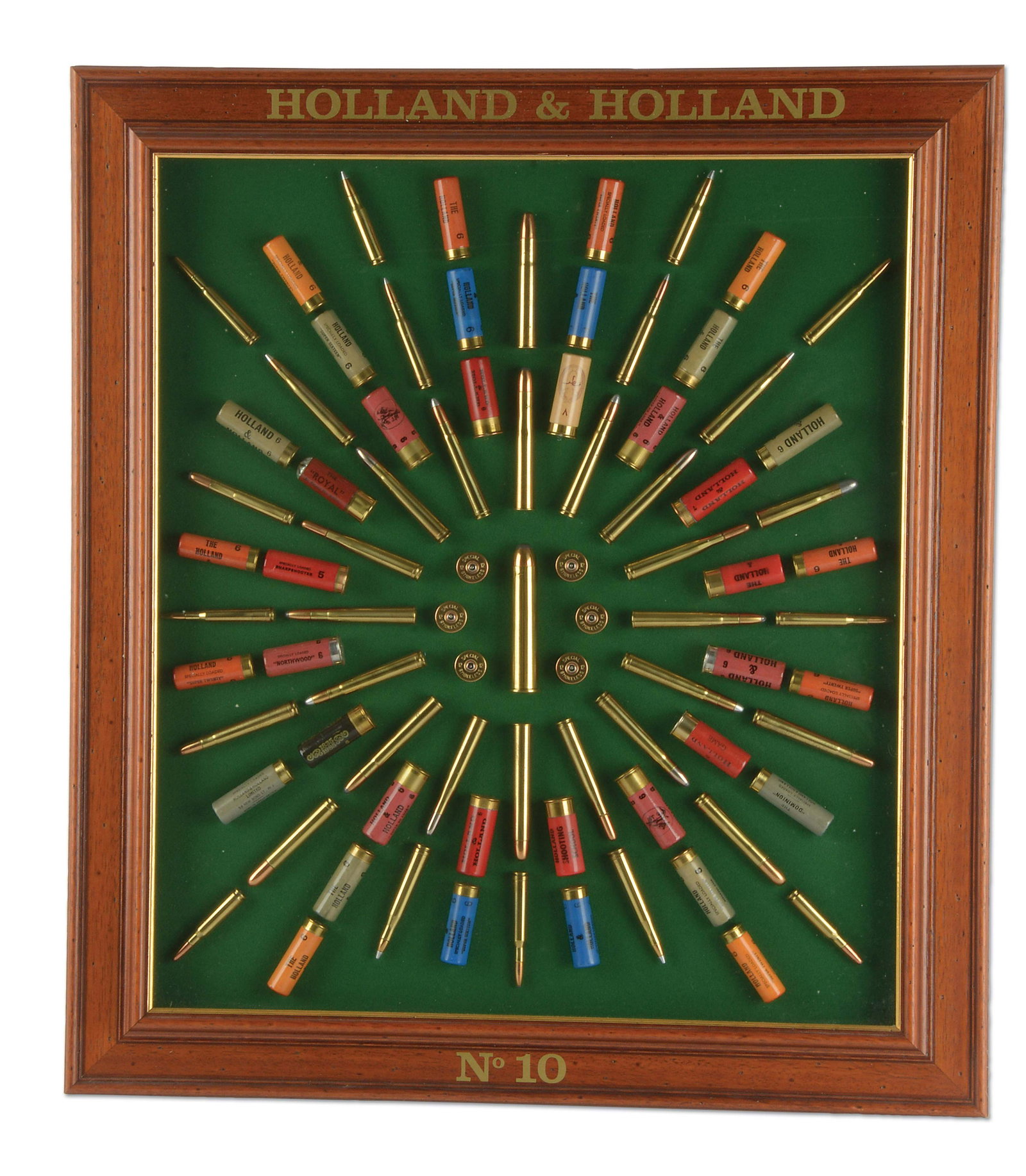FRAMED HOLLAND & HOLLAND CARTRIDGE DISPLAY.: This great board is number '10' and features the largest commercial cartridge made, the .700 Nitro Express, which rests dead center on this board. It is surrounded by some of the largest cartridges th