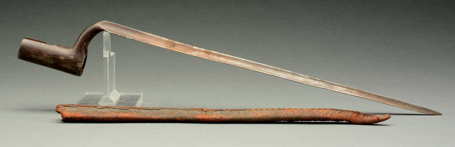 American Fusil Bayonet with Scabbard.: This American bayonet has a 2-1/8" socket with a 7/8" diameter opening. The triangular tapered blade measures 14-1/4". Complete with its original black leather scabbard. CONDITION: Bayonet retains a b