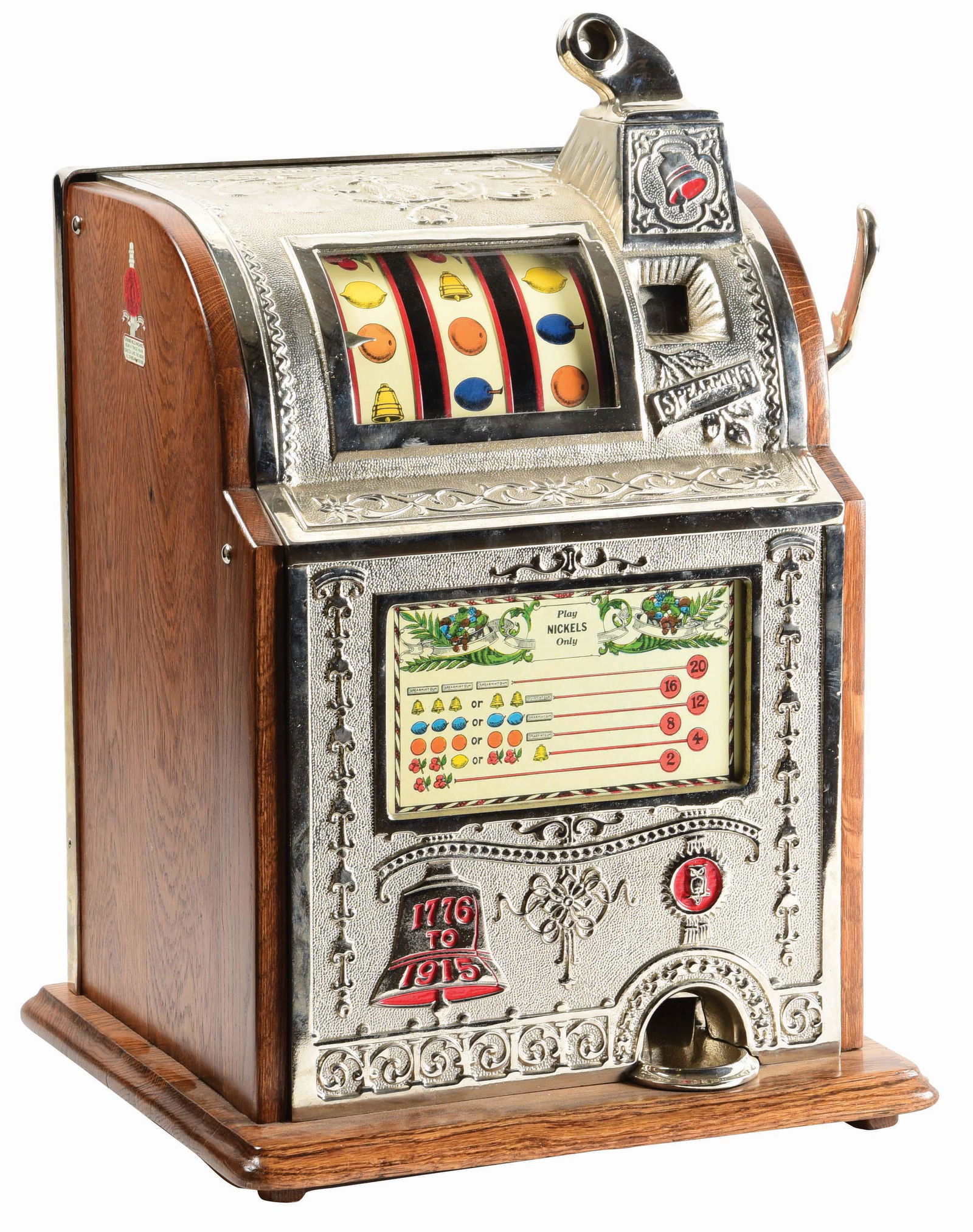 5¢ MILLS NOVELTY CO. OPERATORS BELL SLOT MACHINE.: A Mills Novelty Co. slot machine, also known as the Spearmint, manufactured in 1920. The cast-iron front displays a lovely embossed case, detailed in red. An early restoration with replaced reel strip