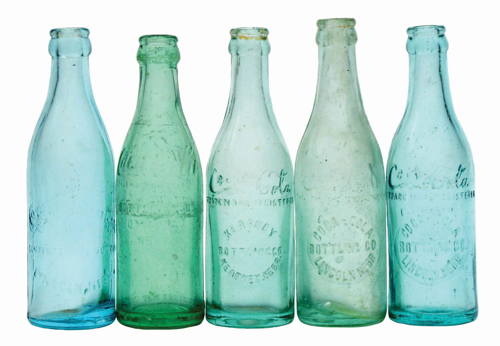 LOT OF 5: NEBRASKA COCA-COLA BOTTLES.: Excellent condition. Condition (Excellent). Dimensions Largest: 7 - 3/4" x 2 - 1/4".