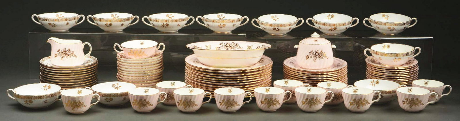 LARGE SET OF ENGLISH MINTON BONE CHINA.: Lot consists of 12 plates, 8" Dia.; 12 plates, 10 - 1/2" Dia.; 12 tea cups; 24 saucers; creamer and lidded sugar; a serving bowl, 10"; 10 double-handled soups, 4 - 1/2" Dia. _ with under plates. Excel