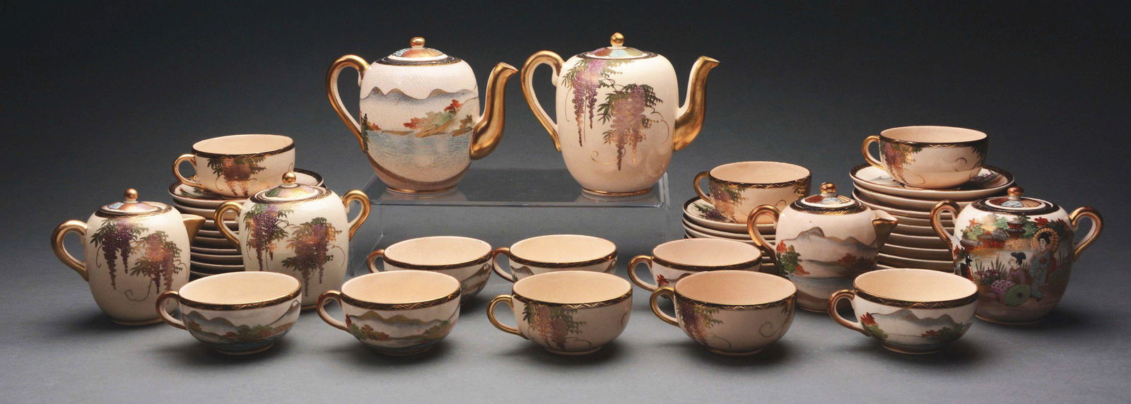 A GROUP OF TWO SATSUMA POTTERY TEA SERVICES. (1 of 1)