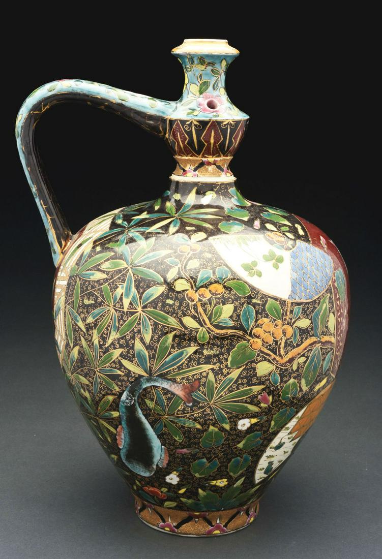 HIGHLY STYLIZED & DECORATED FISCHER J PUZZLE JUG.: Circa 1880's. Motif has floral and leaf patterns and includes a large whale and one tiny whale, a butterfly, a kangaroo, a rooster, two flying birds, wedge shapes, and bamboo stalks. Very slight losse