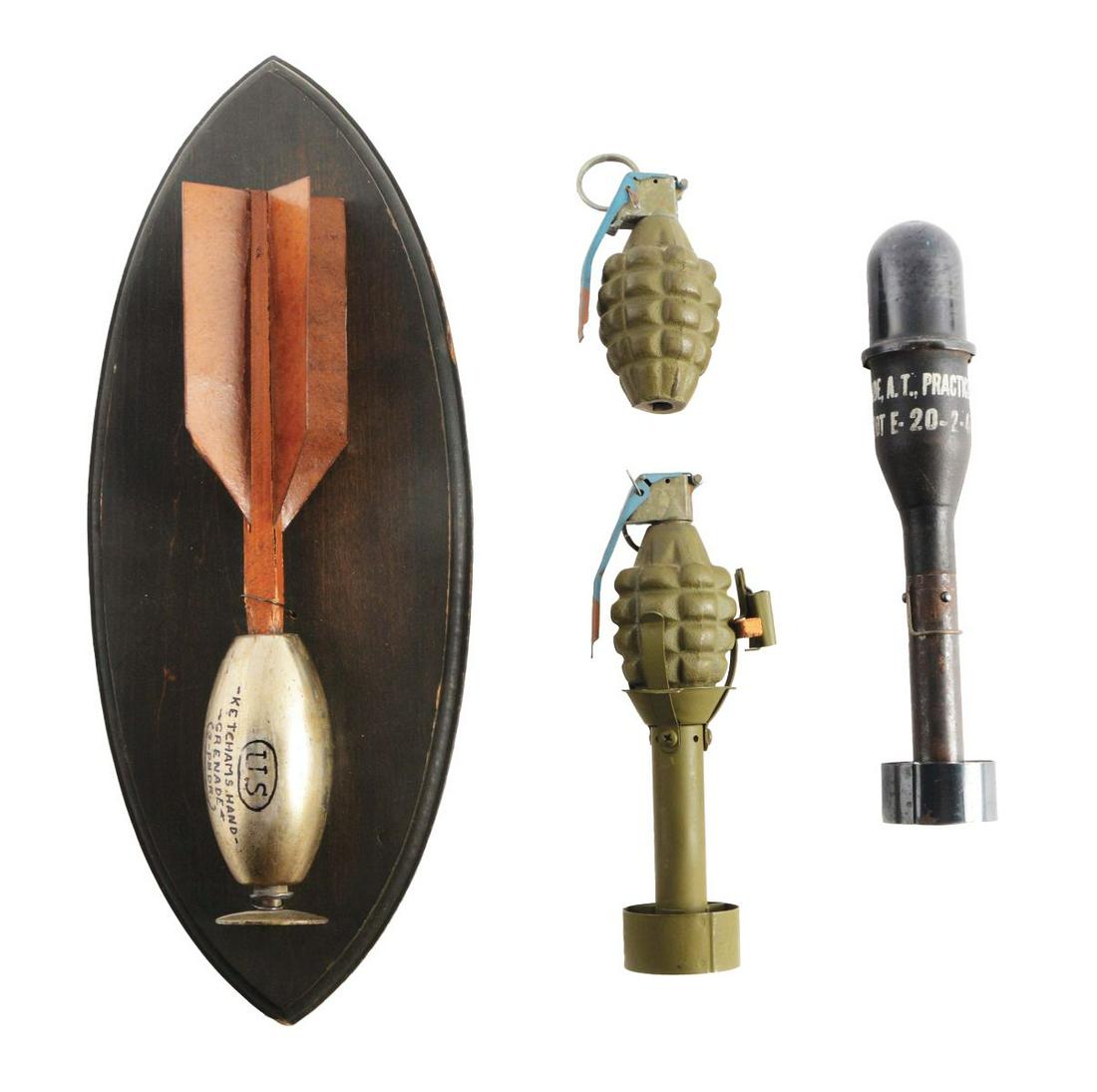LOT OF 4: PRACTICE GRENADES, INCLUDING CIVIL WAR: Lot consists of: (A) 3lb Ketchum grenade with original plunger and fins, mounted to an oval wooden plaque for wall display, most likely done at Bannermans. (B) M-11 A2 practice rifle grenade dated 2-4