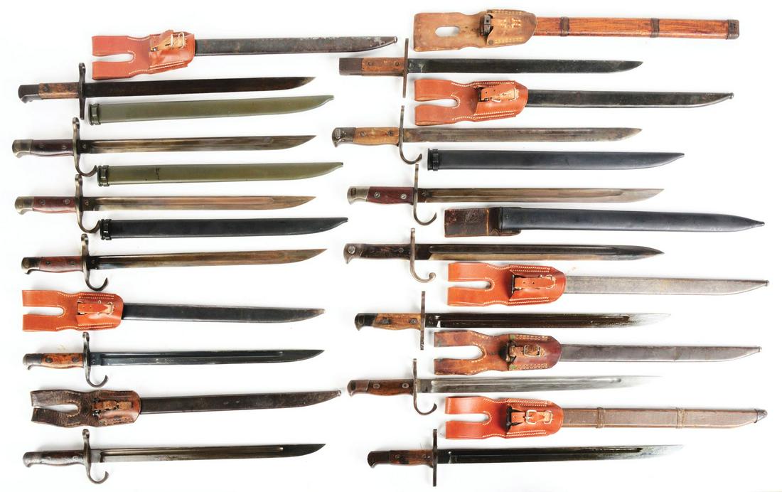 LOT OF 13: JAPANESE ARISAKA BAYONETS.: Lot consists of: 13 World War II Japanese Arisaka bayonets and scabbards. Five have reproduction frogs otherwise all original World War II issue. (B) Four high quality reproduction Type 38 Arisaka bay