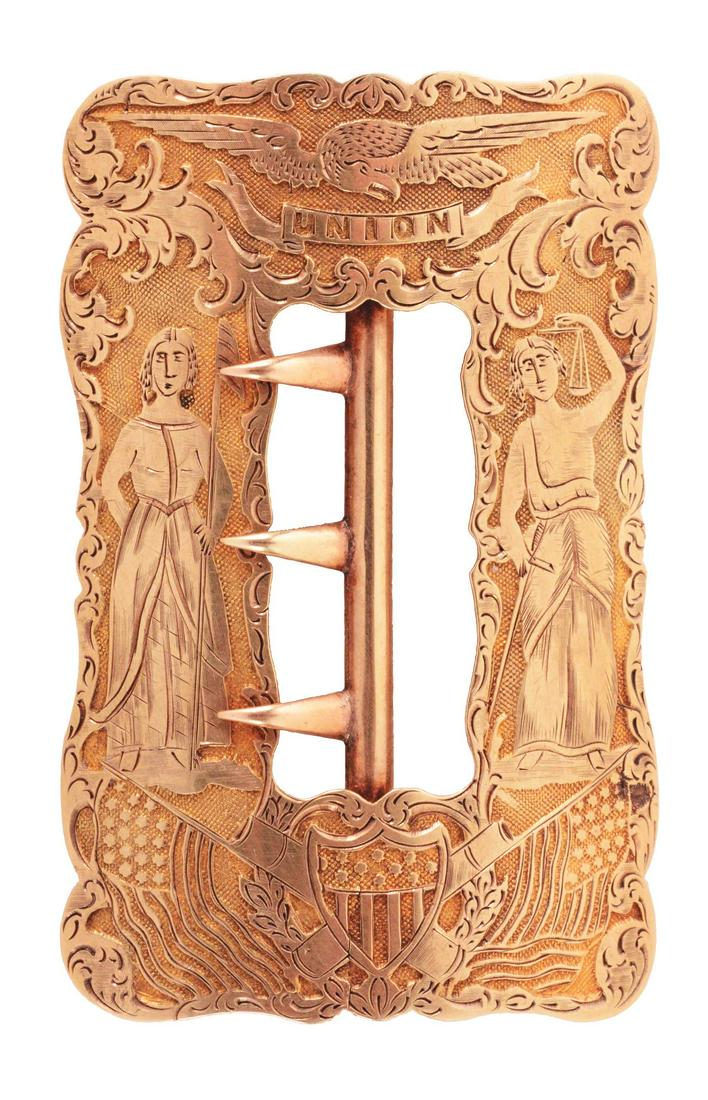 14 KARAT GOLD PRESENTATION BELT BUCKLE CIRCA 1880.: Beautiful solid gold buckle that measures 1-1/2 x 2-1/2" and features Lady Liberty and Justice, stamped Union, with Eagle, shield and cannon. CONDITION: Near mint with no presentation. Weighs 10.7 pen