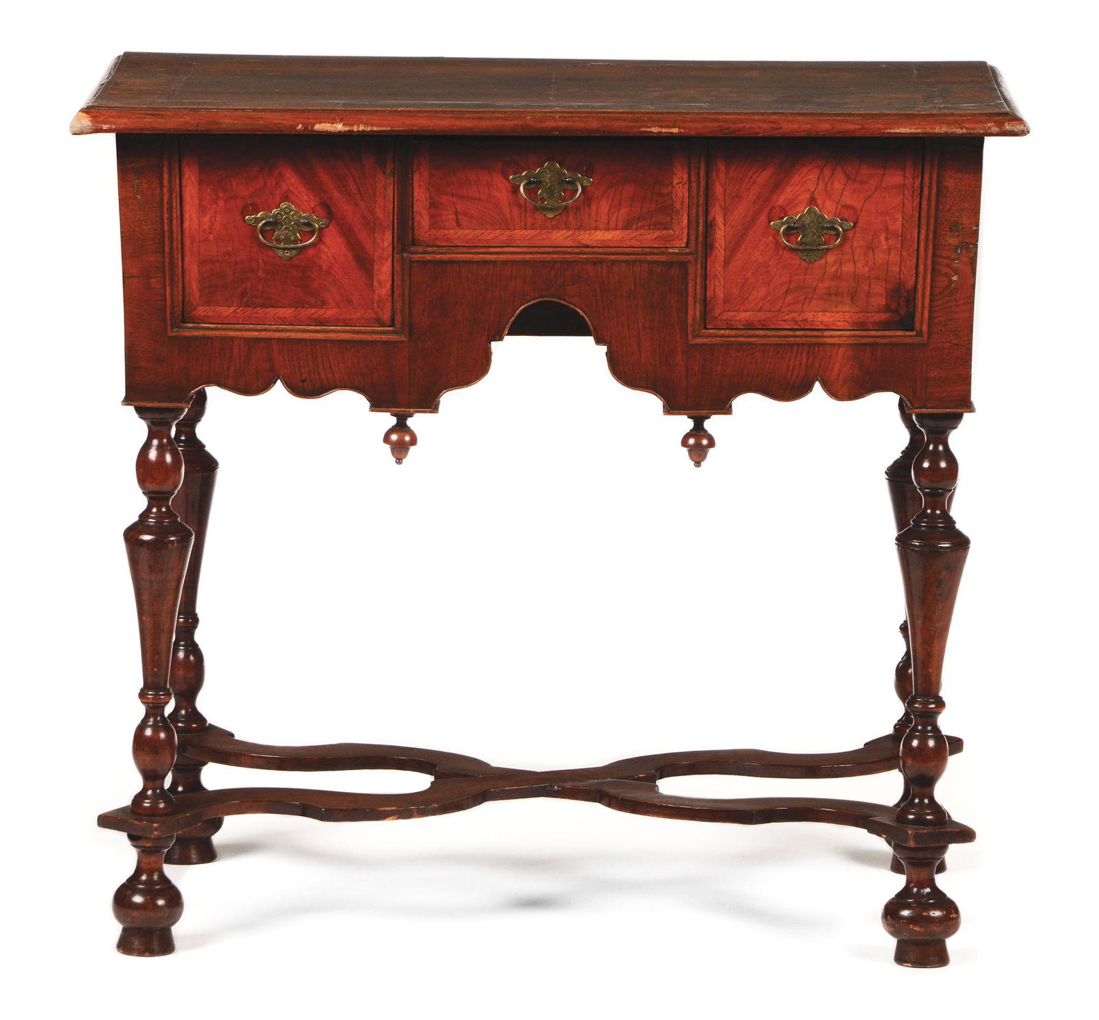VERY FINE WILLIAM AND MARY DRESSING TABLE. BOSTON,: The table has a rectangular molded top with typical four crotch-grained walnut panels surrounded by herringbone and cross banded veneer. The case consists of two deep drawers centering a shallow drawe