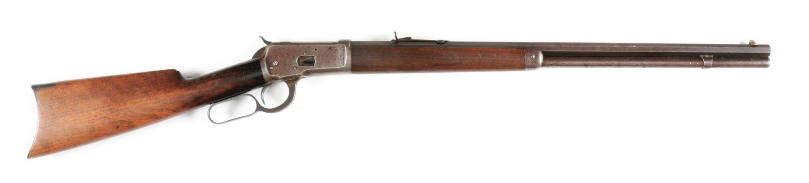 (A) 1ST YEAR OF PRODUCTION WINCHESTER MODEL 1892 LEVER: Very desirable first year production Model 1892 chambered in .44-40. Full octagon barrel with full length magazine tube. Plain straight grain walnut stock and forearm. Crescent rifle style buttplate. 