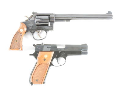 (M) LOT OF TWO SMITH AND WESSON PISTOLS: MODEL 14 .38: Lot consists of: (A) Smith and Wesson Model 14 double action revolver. Factory blued finish with the original wood grips. Adjustable rear sight. CONDITION: Overall very good. Metal retains 95% of its