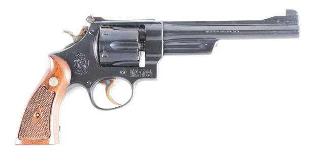 (C) HIGH CONDITION SMITH & WESSON 38/44 OUTDOORSMAN: Heavy duty model of 1950 with scarce 6 - 1/2" barrel, serial number S 97112. Five-screw N-frame. Blue with checkered walnut grips. Includes original gold two-piece box marked "38/44, Outdoorsman