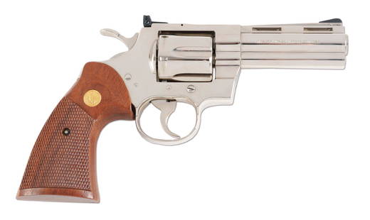 (M) COLT PYTHON .357 MAGNUM REVOLVER: Colt Python Revolver with original box and manual. Classic nickel finish. Serial number dates it to 1979. Cylinder and frame match. Spurred hammer. Original Colt grips. CONDITION: Overall excellent.