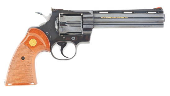 (M) COLT PYTHON .357 MAGNUM WITH BOX: Colt Python with original box and manual. Serial number dates this gun to 1978. Classic blued finish with original Colt wood grips. The Colt Pony and lettering have been dusted, in order for them to