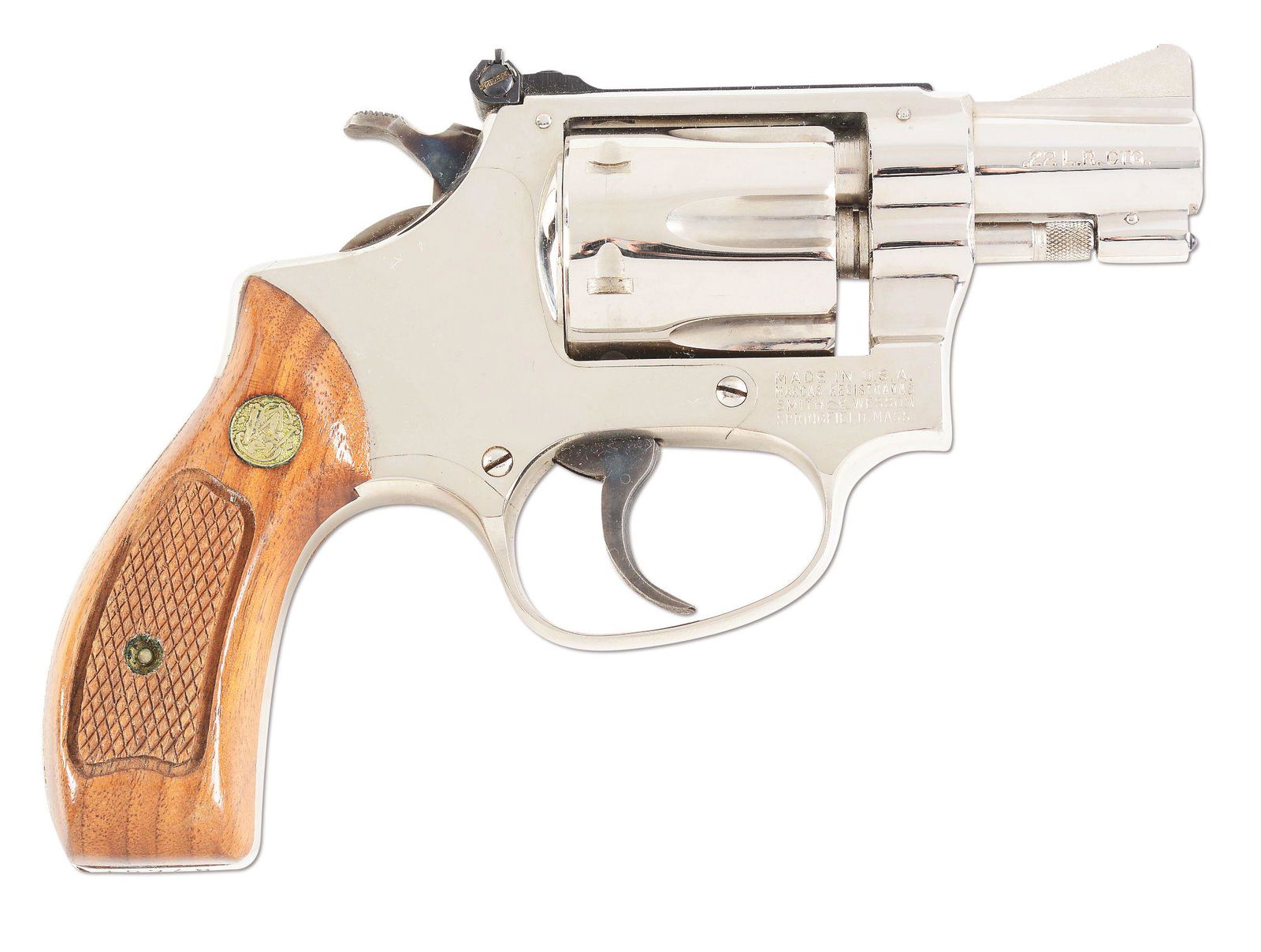 (M) SMITH AND WESSON 34-1 REVOLVER.: Smith and Wesson 34-1 revolver with original box. Produced 1969-1991. Adjustable rear sight. Factory nickel finish and wood grips. Box contains the original cleaning kit and manual. CONDITION: Overall