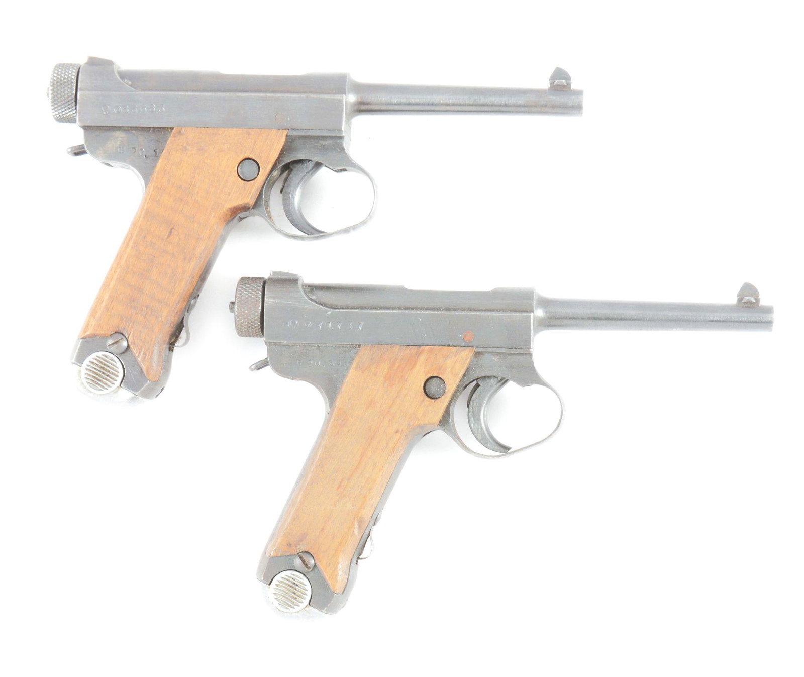 (C) LOT OF TWO: JAPANESE TYPE 14 SEMI-AUTOMATIC: Lot consist of: (A) Japanese Type 14 Nambu with holster. Late war style Nagoya Arsenal production. Made in January of 1945. Serial numbers matching including the magazine. No import mark. Rubberized c