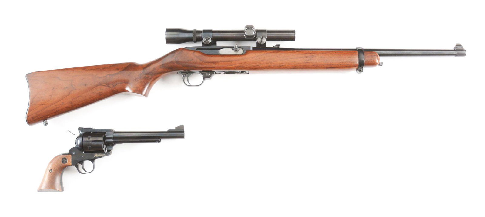 (M) LOT OF TWO: RUGER MODEL 44 CARBINE IN .44 MAGNUM: Lot consists of: (A) Manufactured in 1974, pre-warning label. Nicely figured factory walnut stock. Barrel has been tap for a two piece Weaver scope mount with what appears to be a Weaver 2.5X optic wi