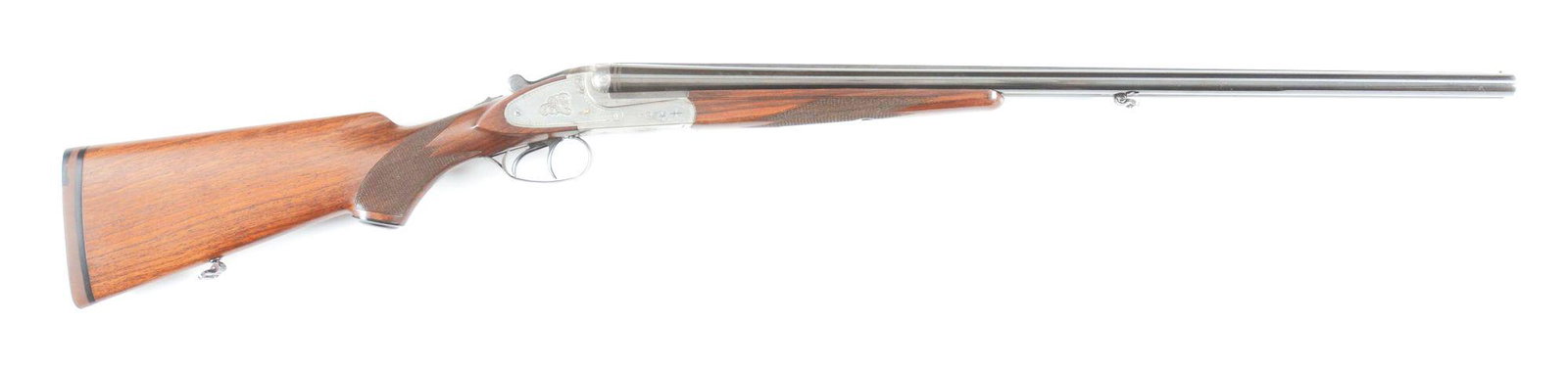 (M) GEBRUDER MERKEL SIDE BY SIDE 20 BORE SHOTGUN.: Circa 1995 A Model 47SL 20 gauge with 26 - 3/4" solid matte concave rib barrel and loop for sling. 2 - 3/4" chambers with automatic ejectors. Standard markings and light scroll engraving on the coin f