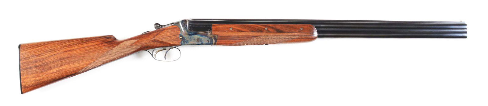 (C) FINE MERKEL MODEL 200 OVER UNDER SHOTGUN WITH: Fine 12 bore gun made with 27" barrels that have solid matted rib with brass front bead. Three piece forend checkered in point pattern with case hardened and engraved Deeley release. Case hardened act