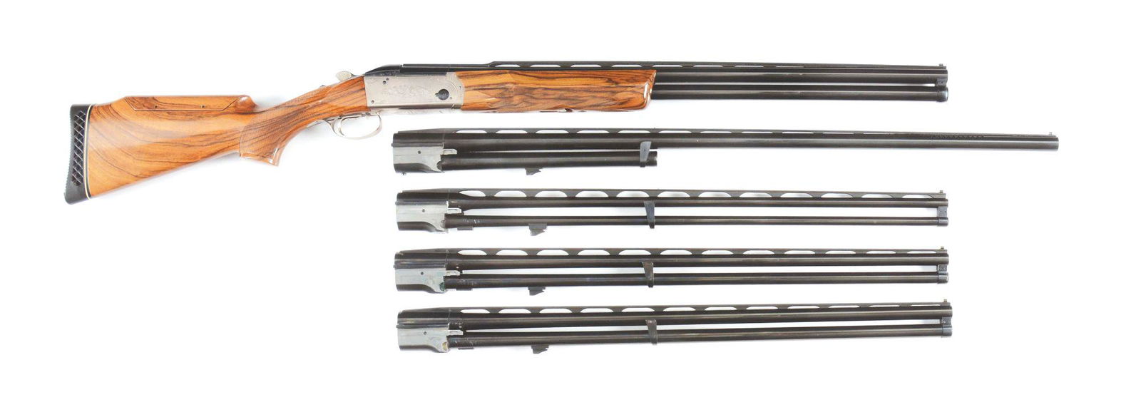 (M) KRIEGHOFF K80 OVER UNDER MULTI CALIBER SHOTGUN WITH: A beautiful multi functional shotgun. This K-80 has four over and under 28 inch barrels: 12, 20, 28 and .410 barrels as well as a bonus single 12 gauge 34 " ported trap barrel. All barrels have raised