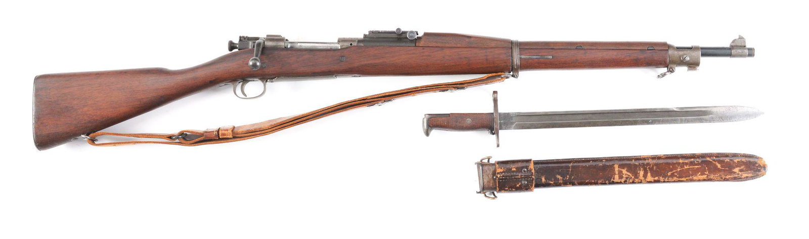 (C) SPRINGFIELD 1903 BOLT ACTION MILITARY RIFLE WITH: 1903 Springfield bolt action rifle with sling and bayonet. Serial number dates this gun to 1915. Sedgley barrel is "U.S.M.C" marked and is dated "9-42". Buttplate is smooth and stempled, making this a