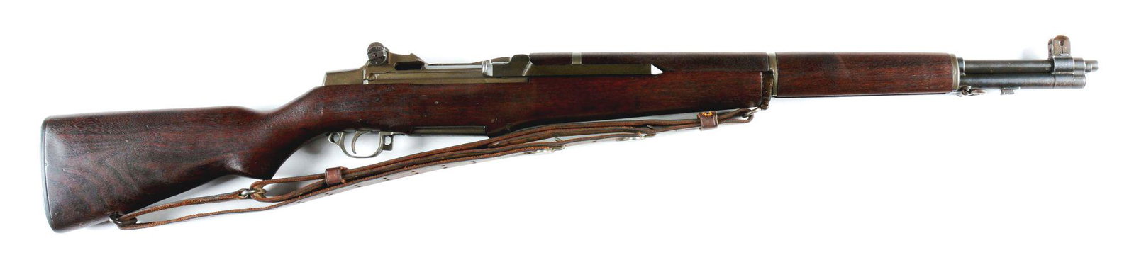 (C) WINCHESTER M1 GARAND SEMI-AUTOMATIC RIFLE.: World War II production Winchester U.S. M1 Garand rifle with correct leather sling and buttstock cleaning kit. February 1944 production receiver with the appropriate Winchester barrel. Correct "lock-b