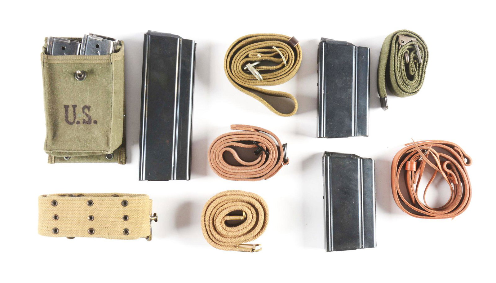 LARGE MILITARIA LOT.: Lot consists of mostly reproduction items such as green woven Garand slings, web belt, Japanese style slings, Mauser slings, six twenty round M-14 magazines, three 30 round steel mags and miscellaneou