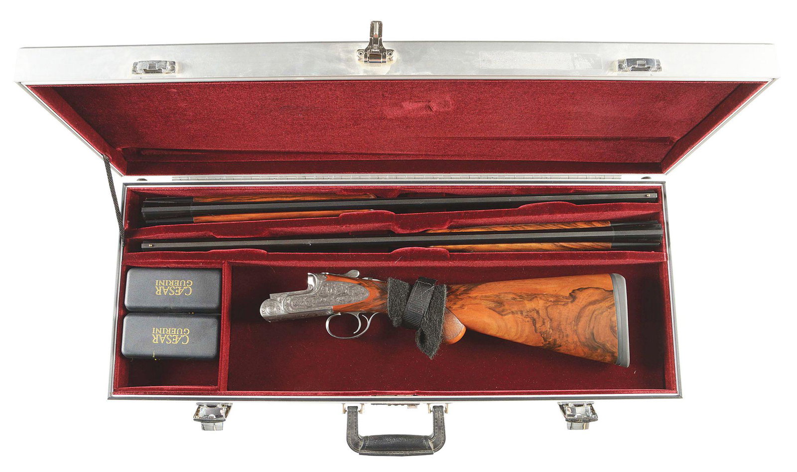 (M) CASED CAESAR GUERINI MAXUM SPORTING O/U SHOTGUN: A very nice 20/28 gauge combination two barrel set. Both set of barrels measure to 28" and have low profile ventilated ribs with brass front bead sights. In addition both sets of barrels are mono bloc