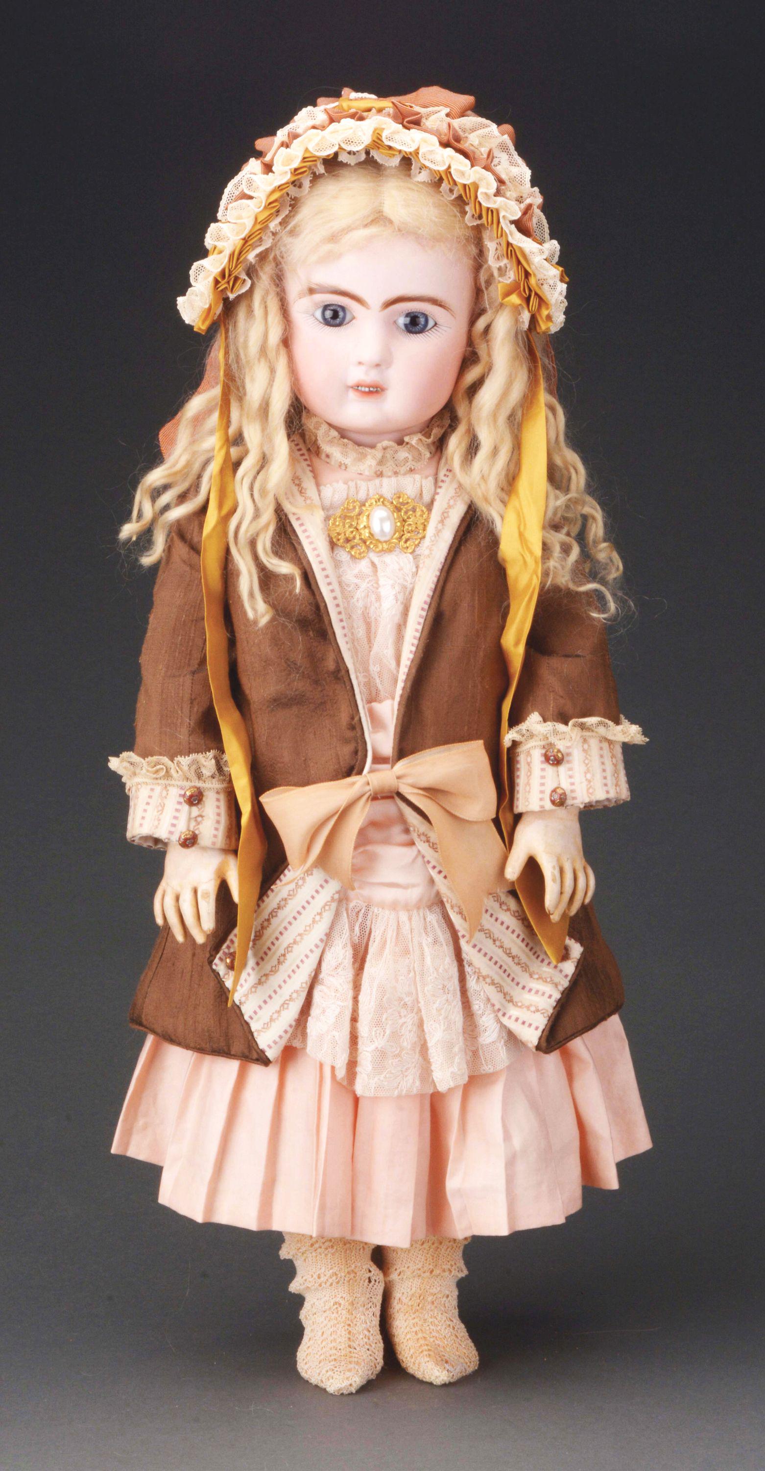ATTRACTIVE JULES STEINER BEBE.: Seldom found Steiner with two rows of tiny teeth, 24", incised on back of head "A 17" and also with a blue stamp reading "Le Parisien Bte S. G. D. G. A 17". She has blue-grey paperweight eyes, well pa