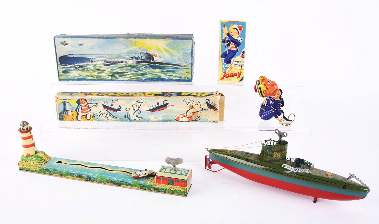 LOT OF 3: GERMAN PRE AND POST-WAR TIN-LITHO TOYS.: First is a Lehmann NR900 Johnny Sailor climbing toy with nice colorful original box, foot is marked "Made in Western Germany". Second item is a pre-war Arnold wind-up Submarine no. 29 with gun on fron
