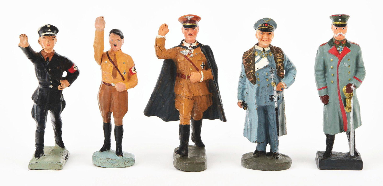 LOT OF 5: VARIOUS LINEOL AND ELASTALINE COMPOSITION: Includes a saluting Adolf Hitler with raised right arm, wearing Nazi armband. There is also another saluting Adolf Hitler with bisque-type face and cape. Next is a General Goering holding baton, a von