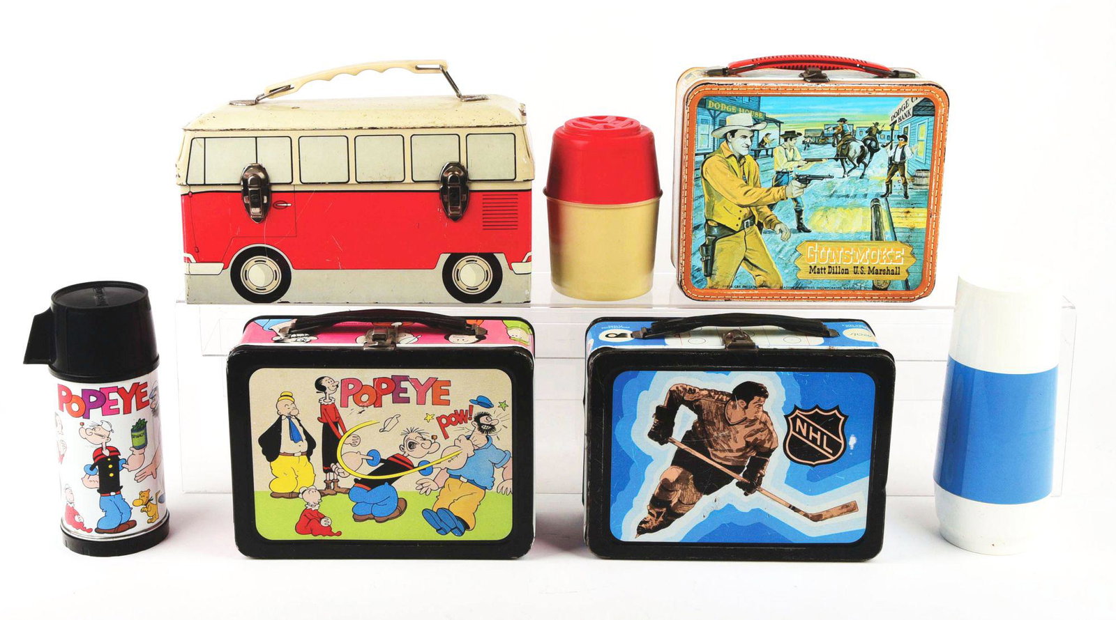LOT OF 4: 1950'S - 1960'S LUNCHBOXES WITH 3 MATCHING: First is a 1959 Gunsmoke Matt Dillon, U.S Marshall from the TV show. It is rare to find this lunchbox with the incorrect spelling of 'Marshall", commonly referred to as the double "LL". Tin-litho west