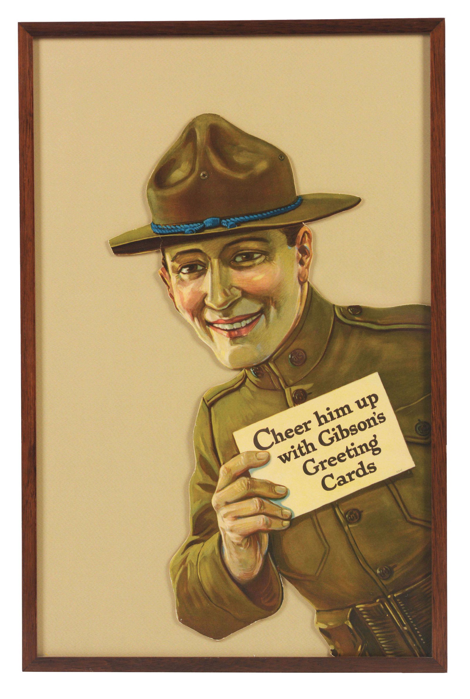C. 1915 GIBSON'S GREETING CARDS SOLDIER CUTOUT.: Made of very heavy cardboard and framed under glass and designed to have been displayed around the side of a door frame in a retail establishment or elsewhere. Very crisp and bright and in unused cond