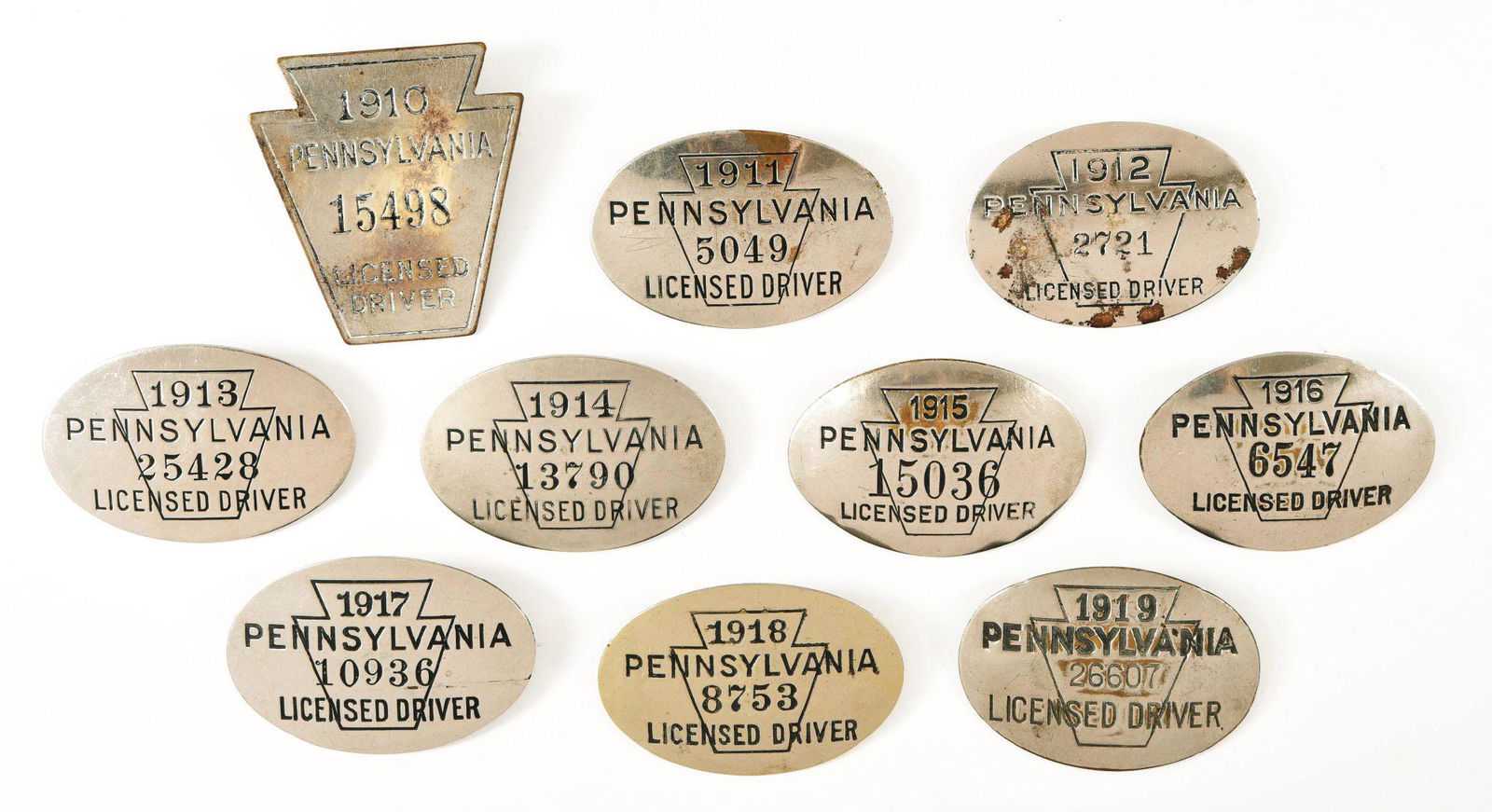 GROUP OF 10 PA LICENSED DRIVER BADGES. (1 of 2)