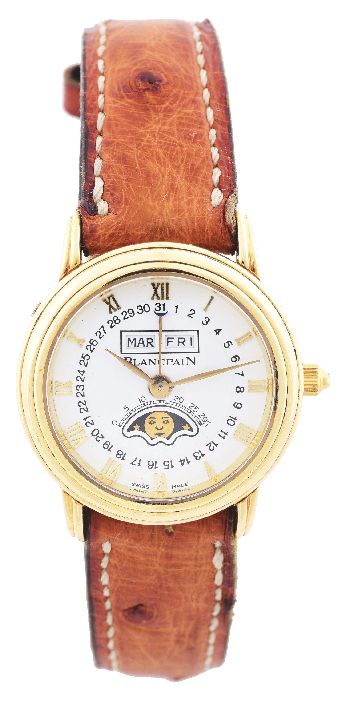 LADY'S 18K GOLD BLANCPAIN, SWISS TRIPLE-DATE CALENDAR: Lady's Blancpain Swiss triple-date calendar wristwatch with moon phases in 18K yellow gold. Circa 1980's. Case diameter 26mm, thickness 8mm, with 14mm lugs. White dial with gold Roman numeral markers