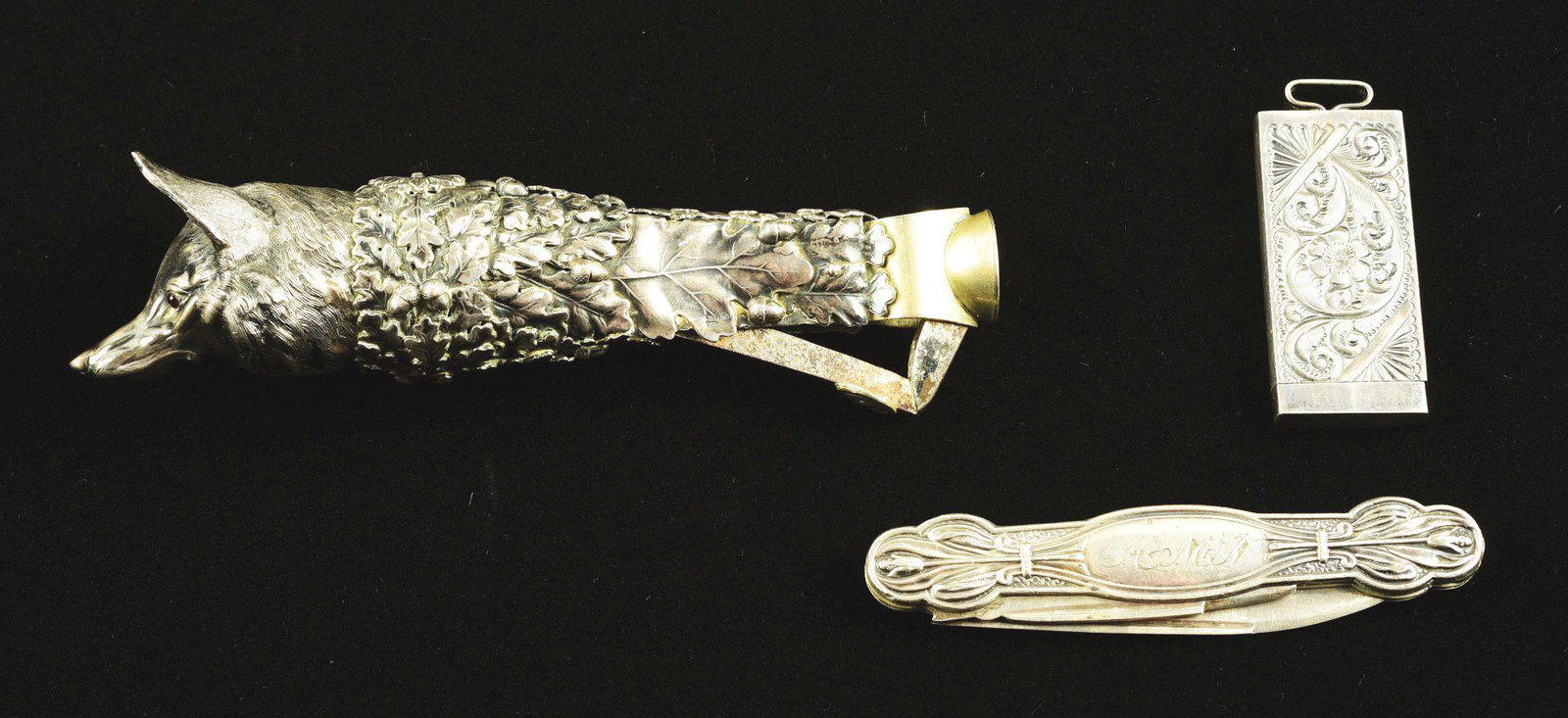 LOT OF 3: FIGURAL CIGAR CUTTER, STERLING EMBOSSED BOX,: Lot consists of: first, a figural fox cigar cutter with ruby glass eyes, exquisite detail to fox, works well, 5" long; second, a sterling silver embossed box, marked sterling, "Name Inside", 1 - 3/4" 