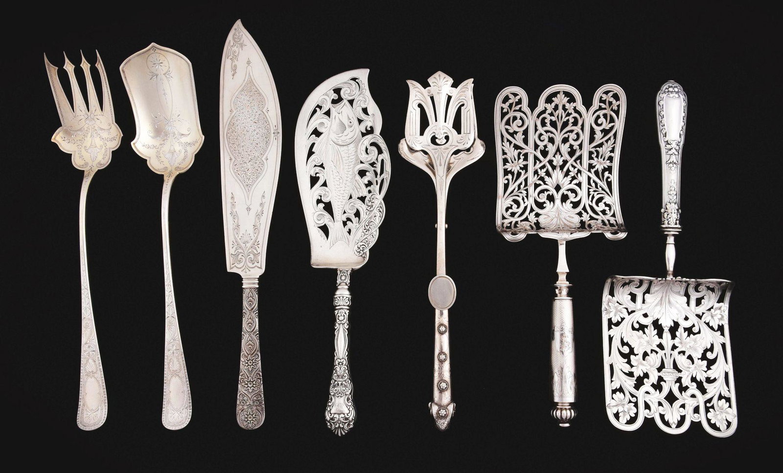 A GROUP OF AMERICAN STERLING SERVING ARTICLES.: 19thC. Including a pair of sprung tongs, Ball Black & Co., with pierced blades and a thin elongated handle with a ram’s head terminal; a Tiffany cake slice, Antique Engraved pattern, with a blade en