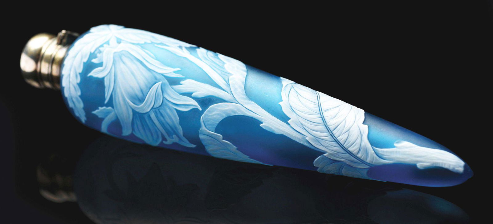 THOMAS WEBB CAMEO ENGLISH PERFUME BOTTLE.: 6 - 3/4" long, beautifully carved with blue background, floral motif, sterling cap and hallmarks. Condition: (Excellent). Dimensions: 6 - 3/4" x 1 - 1/2" x 1 - 1/4".