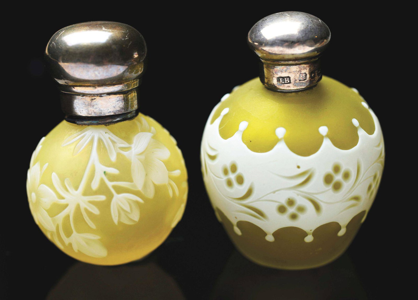 LOT OF 2: MINIATURE THOMAS WEBB CAMEO ENGLISH PERFUME: Lot consists of two miniature Thomas Webb cameo English perfume bottles. The first is 2" tall with a floral motif and screw cap. The second is 2" tall with an unusual design, marked "L. B." with hallm