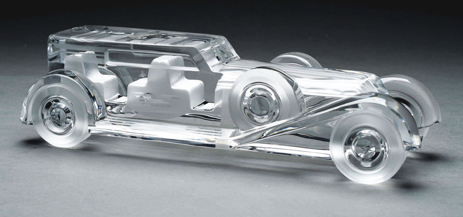 DAUM CRYSTAL IMPERIAL LIMOUSINE.: A French crystal and etched Imperial Limousine Desk Paperweight designed by Xavier Froissart for Daum, c. 1987. Signed “Daum France”. The Limousine Imperial was the 4th of 13 Standard Large Automo